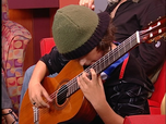 12 year-old Chris Monteverde makes tv debut performing concert pieces, with Juan Carlos Vera in the background. 